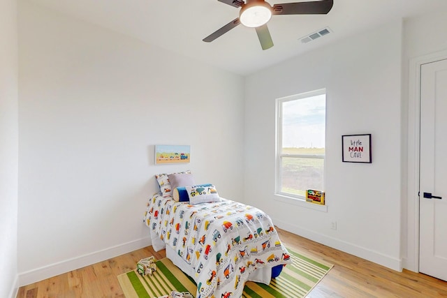 bedroom featuring light hardwood / wood-style flooring and ceiling fan