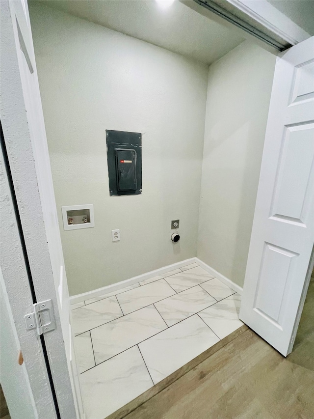 clothes washing area featuring light wood-type flooring, hookup for a washing machine, and electric dryer hookup