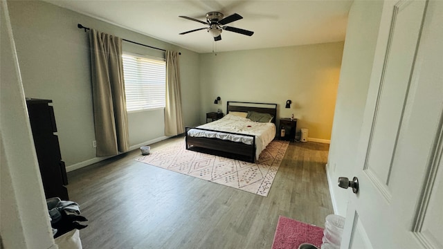 bedroom featuring ceiling fan and light hardwood / wood-style floors