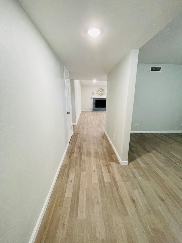 corridor featuring light wood-type flooring