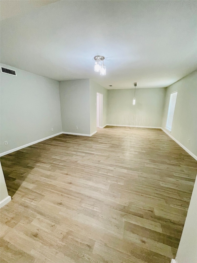 unfurnished room featuring light wood-type flooring