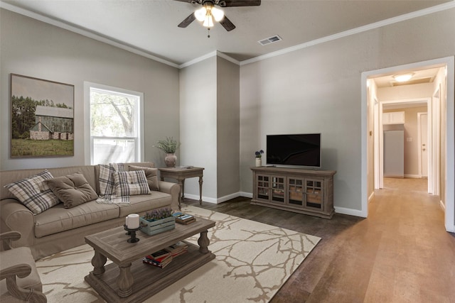 living room with ceiling fan, crown molding, and hardwood / wood-style floors