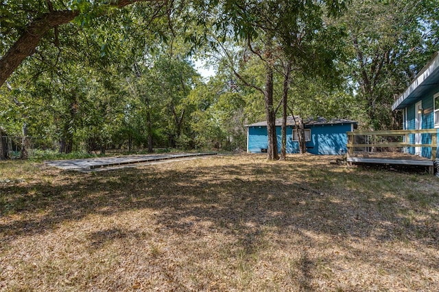 view of yard with a deck