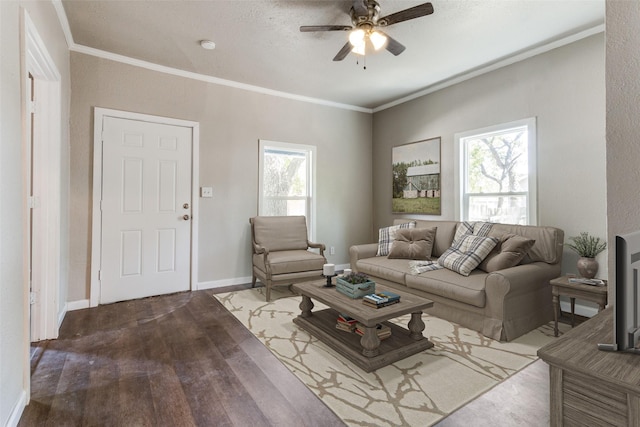 living room featuring ceiling fan, ornamental molding, a healthy amount of sunlight, and hardwood / wood-style flooring