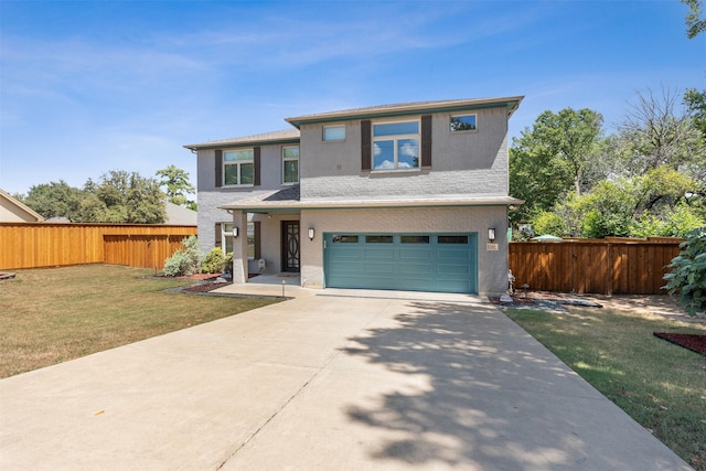 traditional home featuring a garage, concrete driveway, a front yard, and fence