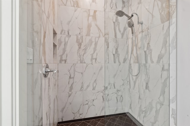 bathroom with tiled shower