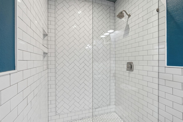 full bathroom with tiled shower