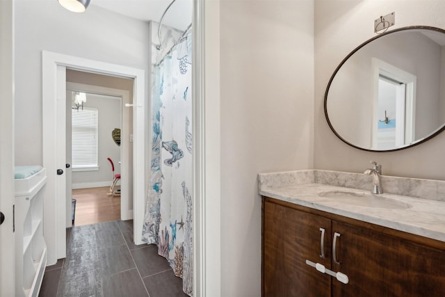 full bathroom with vanity and a shower with shower curtain