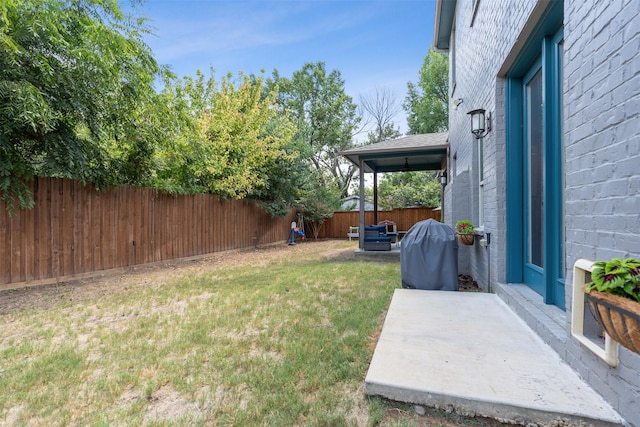 view of yard with a fenced backyard and a patio