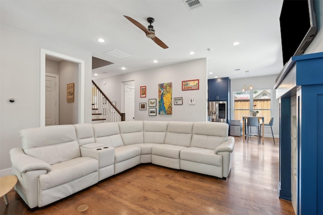 living area with a ceiling fan, visible vents, wood finished floors, and recessed lighting