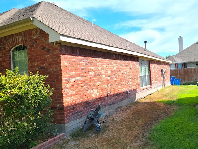 view of property exterior featuring a lawn