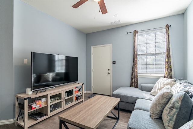 living room with ceiling fan and hardwood / wood-style flooring