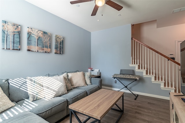 living room with ceiling fan and dark hardwood / wood-style floors