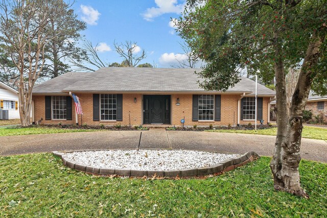 ranch-style home with a front lawn