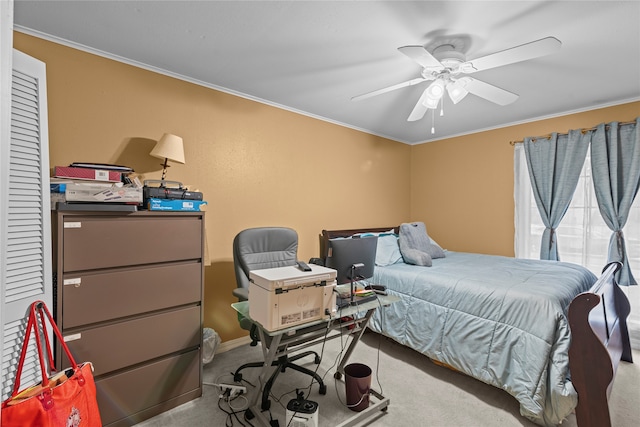 carpeted bedroom featuring ornamental molding and ceiling fan