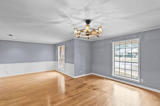 single story home featuring a garage, a sunroom, and a front lawn