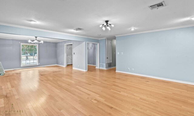 dining room with ornamental molding and light hardwood / wood-style flooring