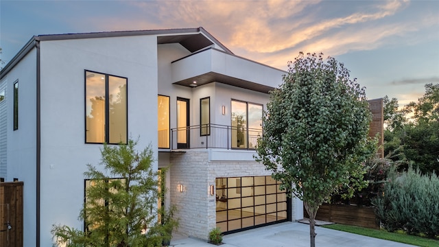 view of front of home with a balcony