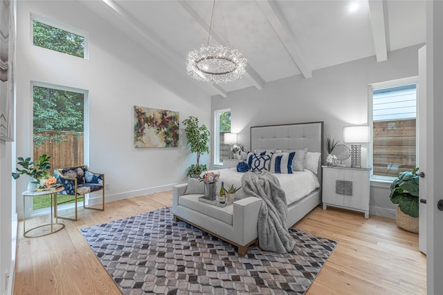 bedroom with hardwood / wood-style floors, vaulted ceiling with beams, and a chandelier