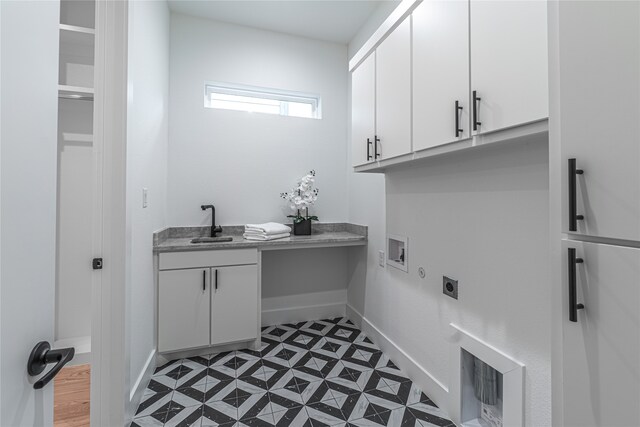 washroom featuring sink, electric dryer hookup, cabinets, and hookup for a washing machine