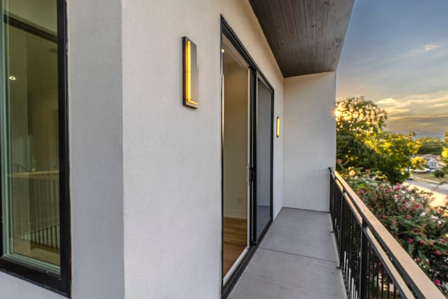 view of balcony at dusk