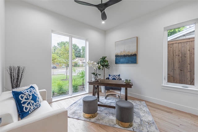 office featuring ceiling fan, plenty of natural light, and hardwood / wood-style floors