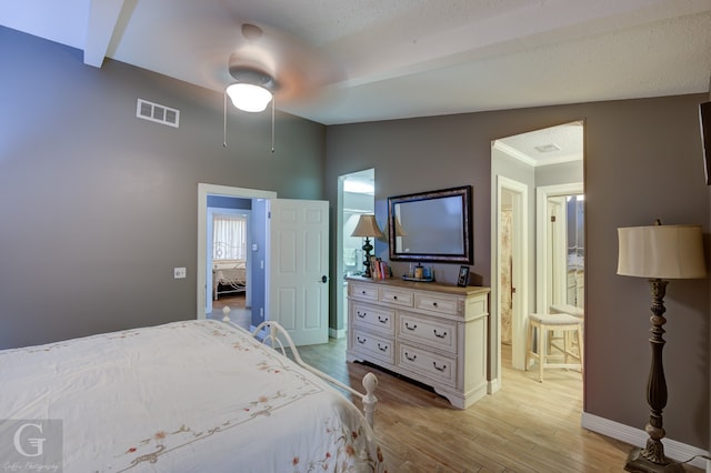 bedroom with light hardwood / wood-style flooring, ceiling fan, and vaulted ceiling