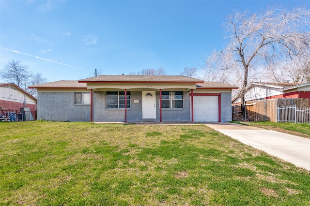 ranch-style house featuring a garage and a front lawn