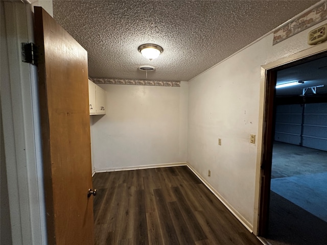 spacious closet featuring dark hardwood / wood-style flooring