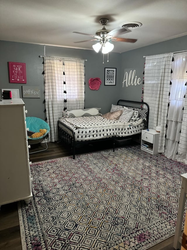 bedroom featuring ceiling fan and hardwood / wood-style flooring