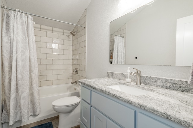 full bathroom featuring hardwood / wood-style flooring, vanity, toilet, and shower / tub combo