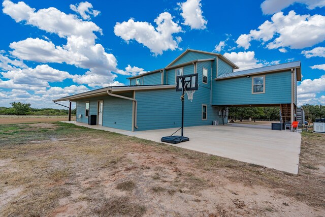 back of property featuring a patio