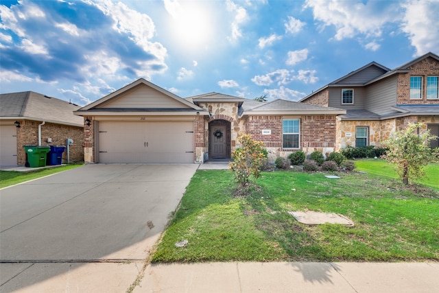 view of front of home with a garage and a front lawn