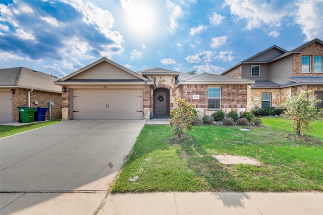 2512 Saldana Dr, Fate, TX 75189 - view of front of home featuring concrete driveway, an attached garage, a front yard, and brick siding