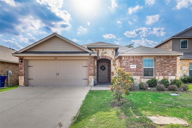 single story home featuring a garage and a front yard