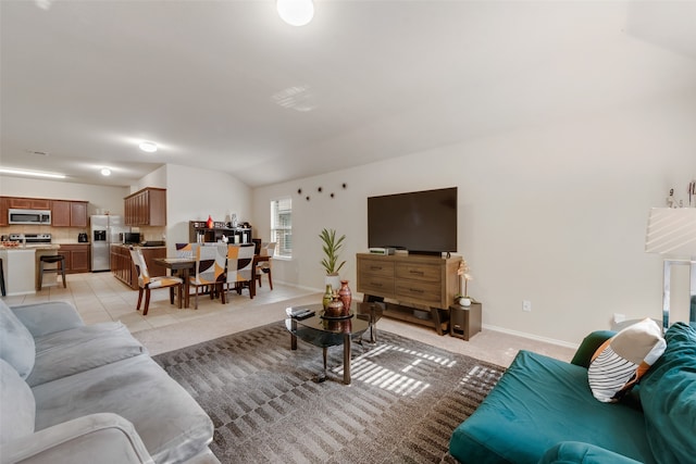 tiled living room with vaulted ceiling