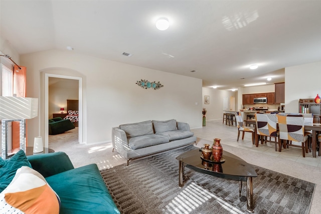 2512 Saldana Dr, Fate, TX 75189 - living room featuring vaulted ceiling and light tile patterned floors