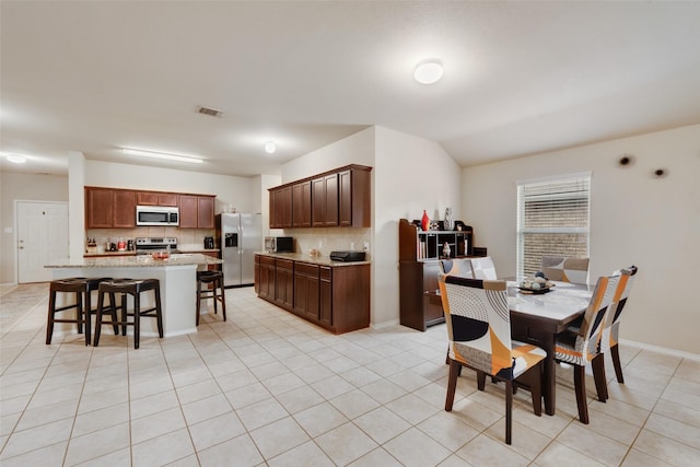 2512 Saldana Dr, Fate, TX 75189 - dining area featuring light tile patterned floors