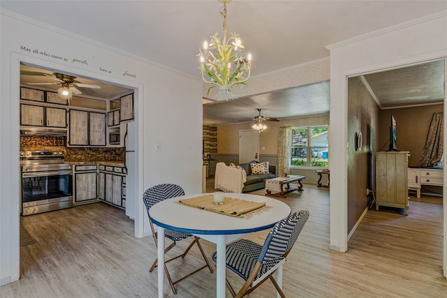 dining space featuring ceiling fan with notable chandelier, light wood-type flooring, and ornamental molding