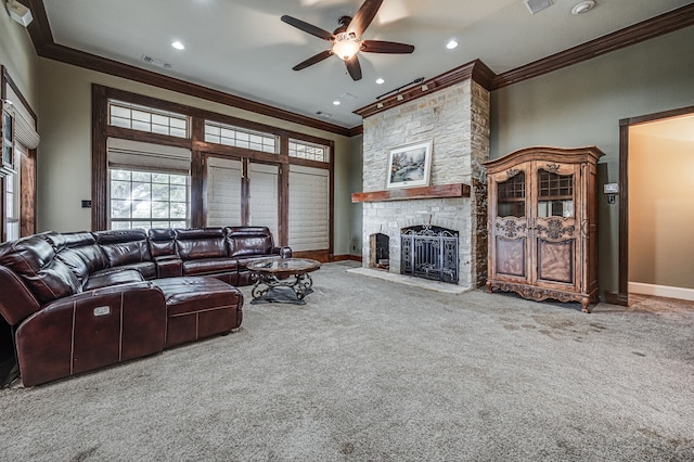 living room with light colored carpet, ceiling fan, ornamental molding, and a fireplace