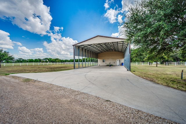 exterior space featuring a yard and a rural view