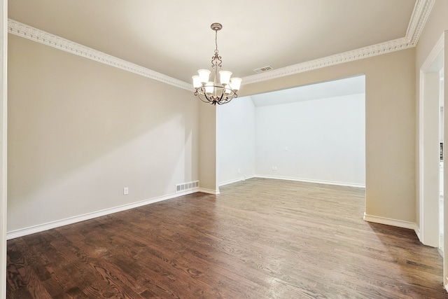 empty room with crown molding, dark hardwood / wood-style flooring, and a notable chandelier