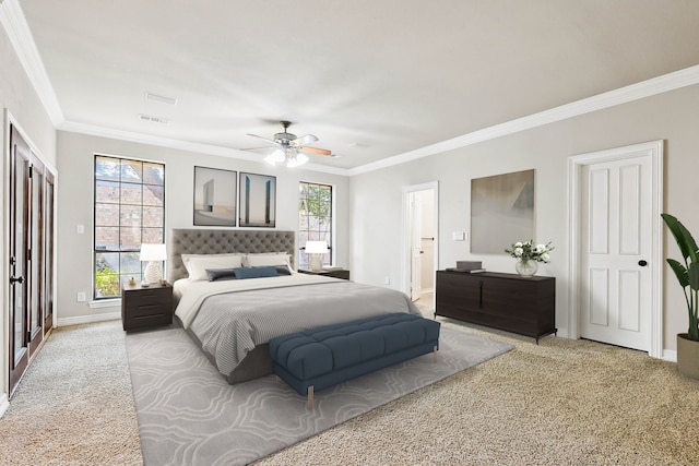 carpeted bedroom with crown molding and ceiling fan