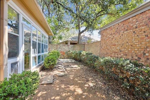 view of patio with a sunroom