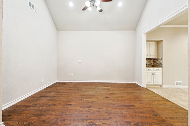 interior space featuring hardwood / wood-style floors, ceiling fan, and vaulted ceiling