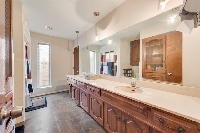 bathroom with plenty of natural light and vanity