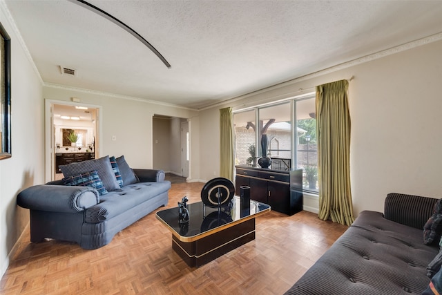 living room with parquet floors, crown molding, and a textured ceiling