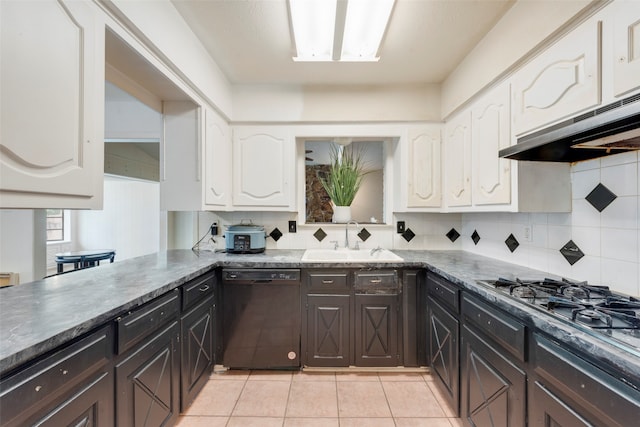 kitchen with stainless steel gas cooktop, backsplash, sink, black dishwasher, and light tile patterned flooring