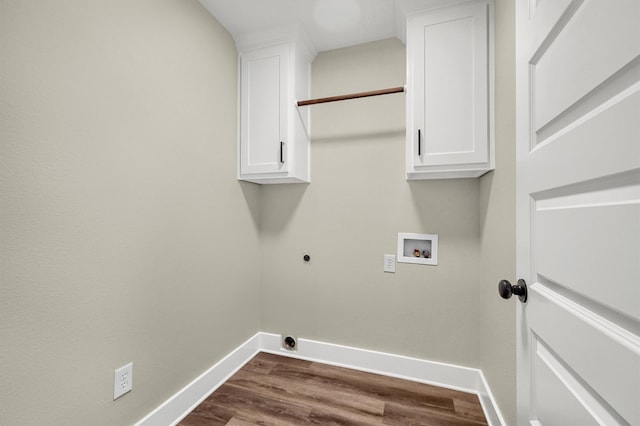 laundry room with washer hookup, hardwood / wood-style floors, electric dryer hookup, and cabinets