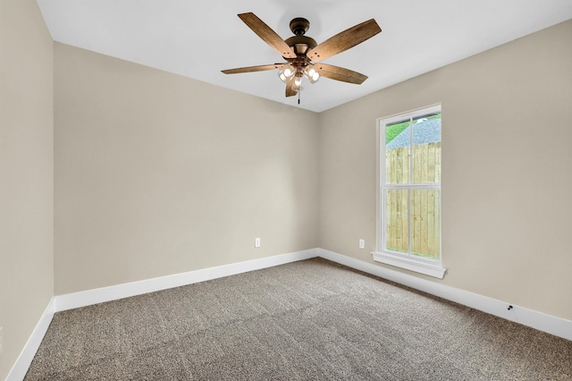 empty room featuring ceiling fan and carpet flooring